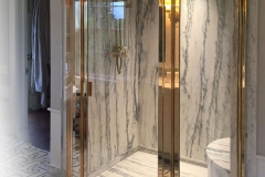 Curved Glass Panels with Solid Polished Unlacquered Brass finish